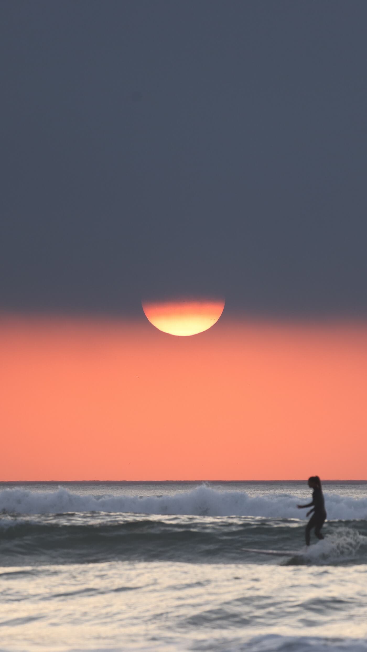Surfer riding wave